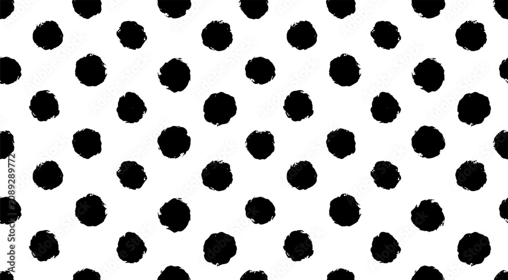 Fototapeta premium hand drawn bold oversized dots vector texture. small polka dot seamless pattern background.hand drawn black and white circle textile