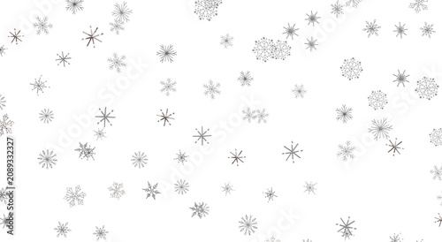 Foto Falling snowflakes on white background create a winter season feeling, great for holiday designs