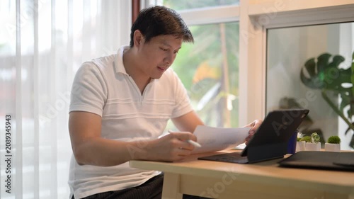 Asian freelancer working from home and feeling tired