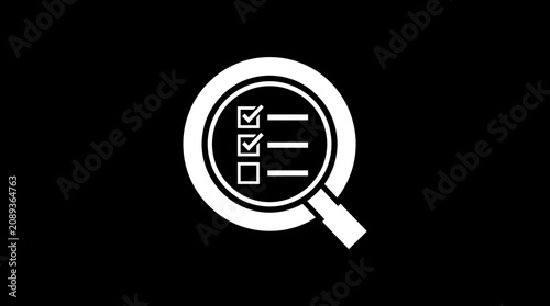 фотографія Magnifying glass with checklist inside.