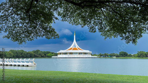 Konstfotografi Beautiful landscape view of King Rama IX Park landmark with lake reflection under tree shade