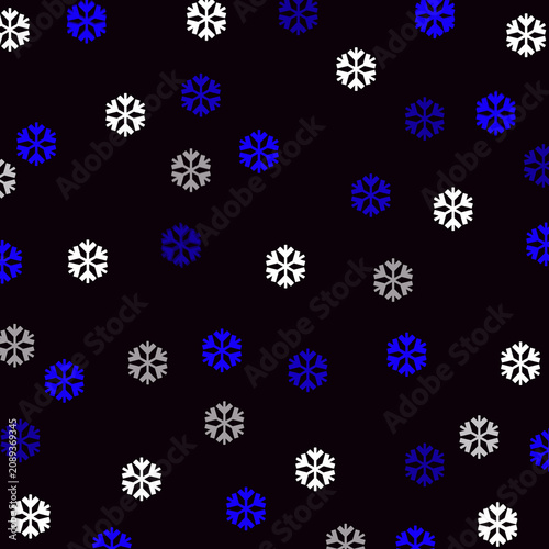 A seamless pattern of white, blue, and gray snowflakes on a black background for winter or holiday designs and decorations
