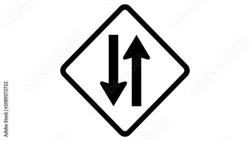 фотографія Road sign featuring two vertical arrows shows that two-way traffic is approaching the intersection