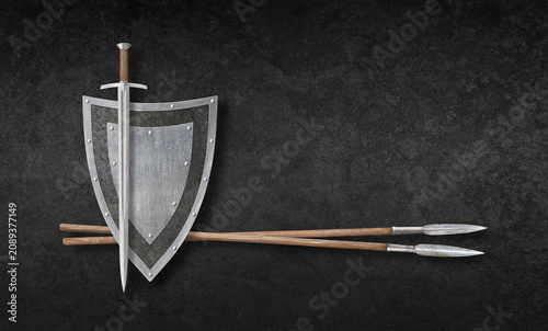 Fotografie sword metal shield and two lances on grunge background