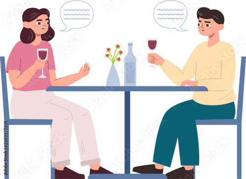 Man and woman sharing a conversation over wine glasses at a social gathering