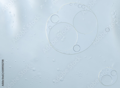 Abstract Blue water bubbles essential oil beauty collagen Serum Repair cell background.