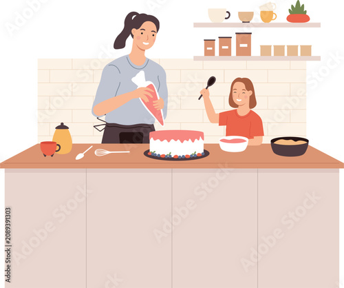 Fotografie Mother and daughter enjoying baking together in a home kitchen, decorating a swe