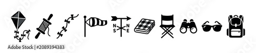Outdoor leisure and weather related icons including a kite, windsock, weather vane, picnic blanket, folding chair, binoculars, sunglasses, and backpack.