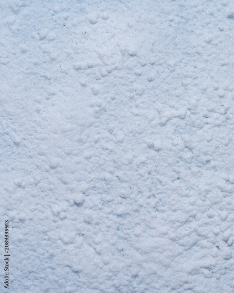 Fototapeta premium Vertical clean snow texture background white winter surface post