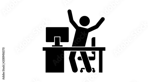 Tableau sur toile Man sitting at office desk celebrating.