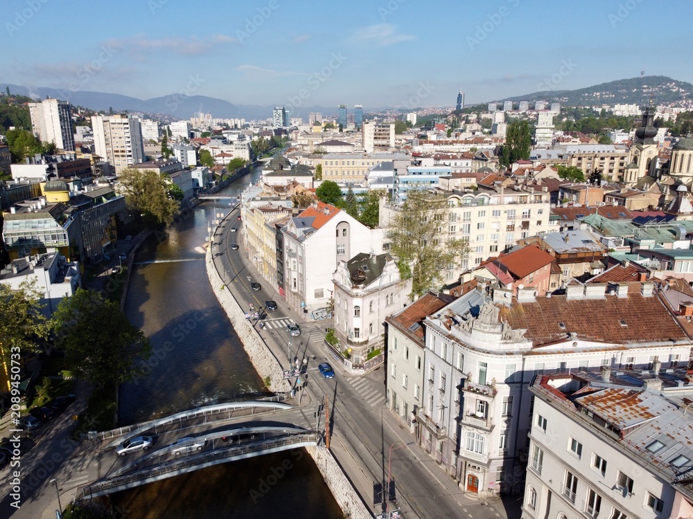Obraz premium Historic Latin Bridge over the Miljacka River and Sarajevo Cityscape in Bosnia and Herzegovina