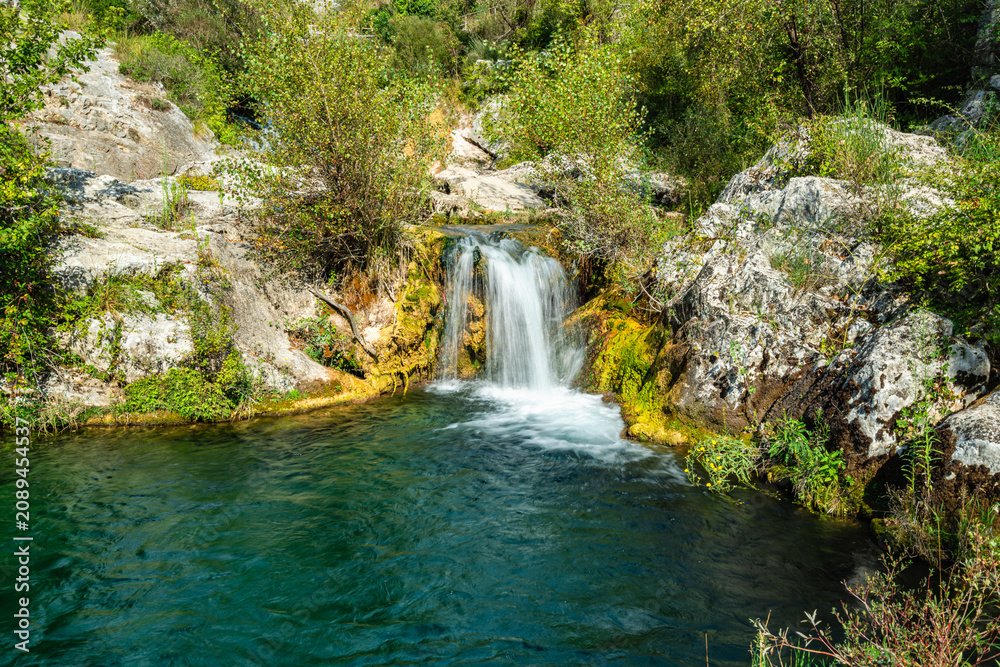 Naklejka premium Waterfall on the Auso river, Cilento, Campania, Italy.