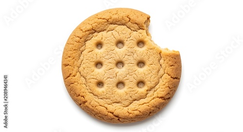 A single round golden brown cookie with a bite taken out of it, featuring a pattern of small holes, isolated on a plain white background