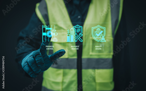 Schilderij op canvas Construction project control concept worker pointing digital hologram progress c