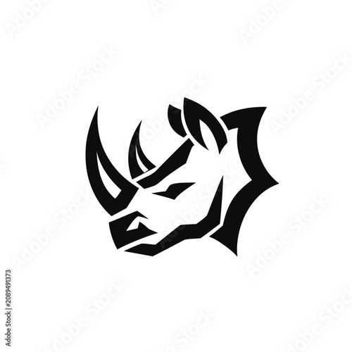 Schilderij op canvas Strong rhino head profile icon with sharp geometric details for sports mascot or modern emblem branding in solid black graphic style