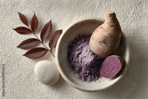 Ube (Filipino purple yam) powder in a bowl, sliced raw purple potato roots, tubers. Used for adding vanilla-nutty flavor to foods. rich in antioxidants  
