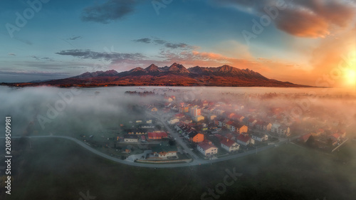 Obraz na płótnie view of the village of Batizovce with fog at sunrise
