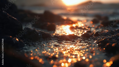 Golden Sunset Reflections on Wet Sand Beach.