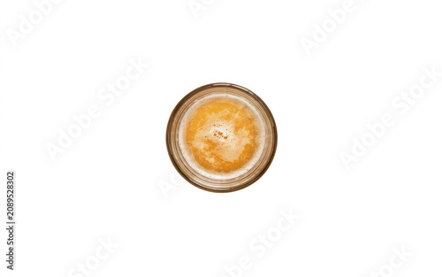 Golden Lager beer in a clear glass with frothy head during studio lighting isolated on transparent background