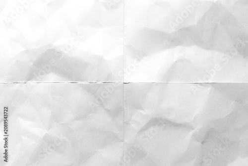 white crumpled and folded paper texture background with crease lines and realistic wrinkled surface, background and overlay