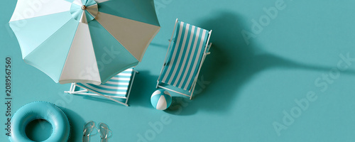 Minimal Summer Beach Flat Lay with Umbrella and Deck Chairssummer, beach, flat lay, minimal, top view, beach umbrella, deck chair, beach chair, inflatable ring, flip flops, beach ball, vacation, holid