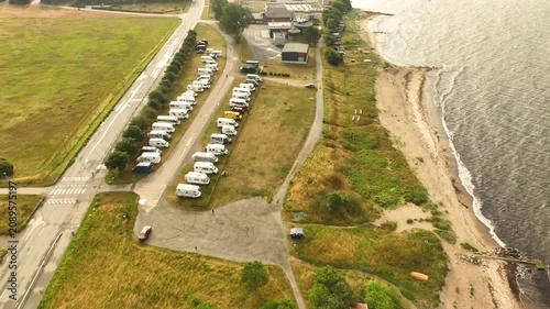 Aerial view of a seaside campsite with recreational vehicles