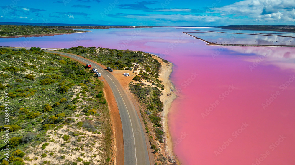 Fototapeta premium Vibrant pink hues of Hutt Lagoon captured from above, a natural wonder in Western Australia