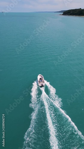 Aerial View of Speedboat Leaving Wake on Turquoise Sea