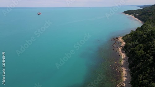 Aerial View of Turquoise Sea, Sandy Beach and Green Forest Coastline