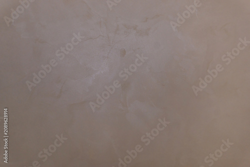 Gray-brown plaster on the wall as a texture.