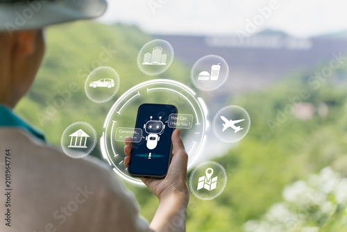 Obraz na plátně Asian traveler using AI and smartphone to plan trips, compare prices, book hotel