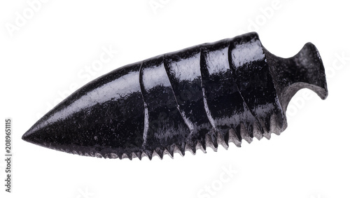 Photos Isolated dark obsidian ancient serrated blade weapon or tool, a fascinating hist