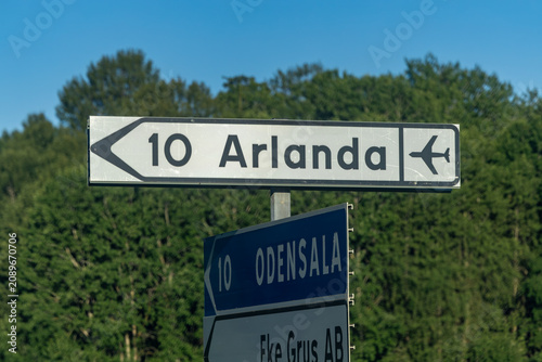 Photography Stockholm, Sweden A small traffic or road sign pointing to the Arlanda Airport, 10 kilometers
