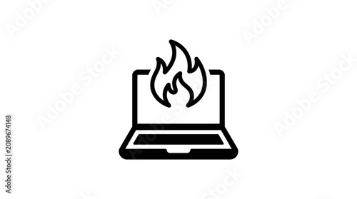 Foto A burning laptop catches fire on a desk indoors.