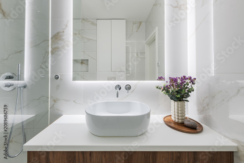 Modern White Marble Bathroom With Vessel Sink, Backlit Mirror and Decorative Flower Vase