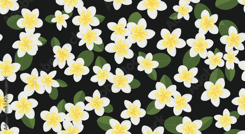 Dense floral pattern of small white plumeria flowers and green leaves scattered on a black background for bold fabric or paper design.