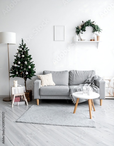 Modern living room with neutral tones and plants.
