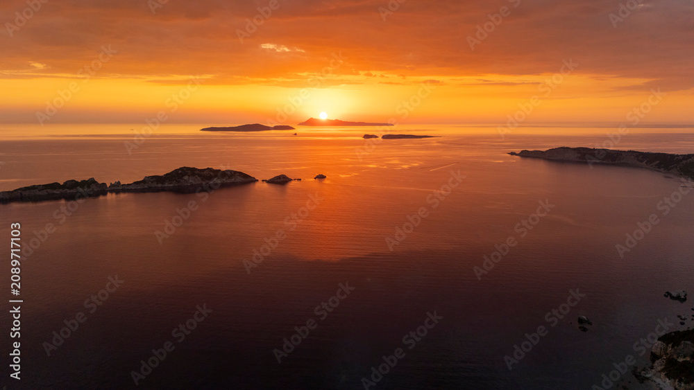 Fototapeta premium Diakopo and Karavi islands at sunset in Ionia Nisia