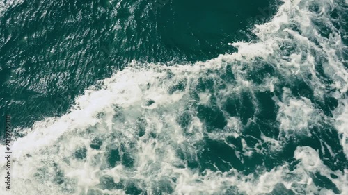 Epic sea water foam ocean waves texture background horizontal cruise ship boat wake.
