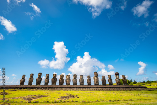 Fotografie Ahu Tongariki Moai on Rapa Nui island set against blue sky