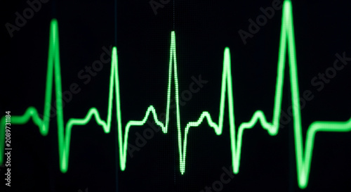 Green Heartbeat ECG Monitor Line on Black Background