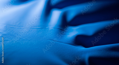 Abstract Blue Fabric Texture Closeup - Rippling Waves of Deep Indigo Textile