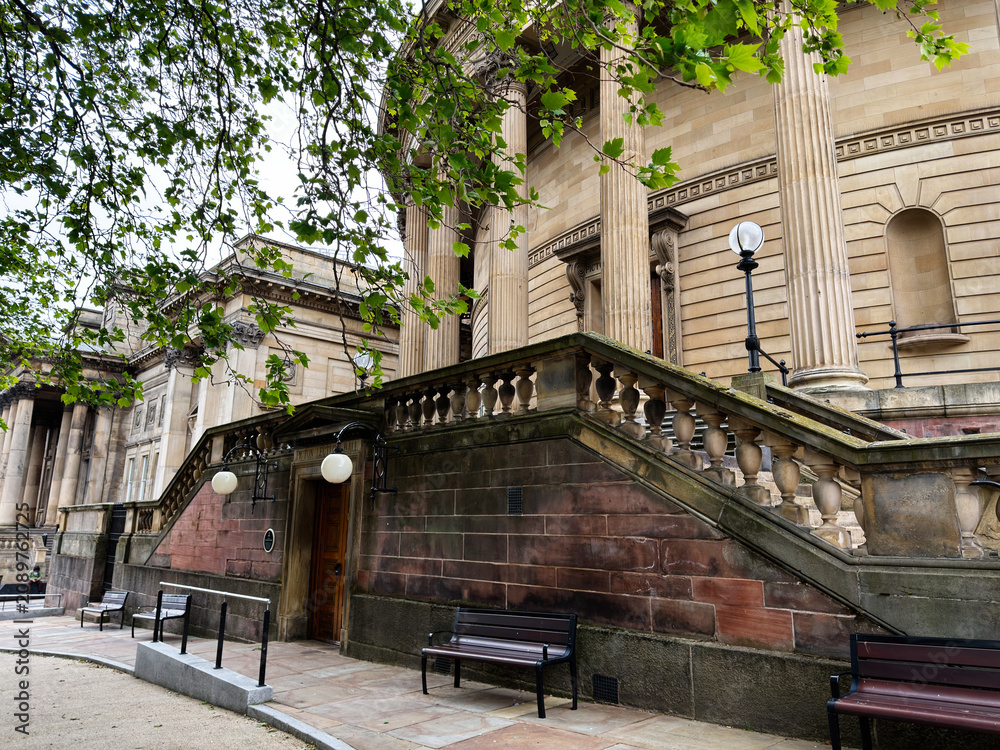 Obraz premium Historic classical Picton Lecture Hall architecture with grand stone stairs and columns in Liverpool, UK city center plaza