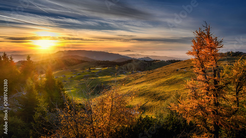 Konstfotografi Velika Planina plateau in Slovenia at sunset with fog