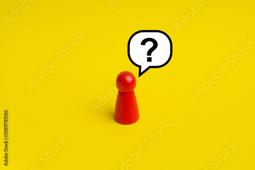 Asking Question concept; Question mark in bubble speech with red peg doll