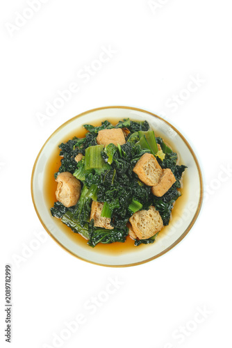 Foto Stir-Fried Asian Greens with Fried Tofu Puffs in Savory Sauce