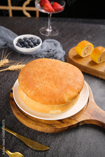 Quadro su tela Fluffy Golden Sponge Cake with Fresh Berries and Cheese Rolls Elegant Dessert Ta
