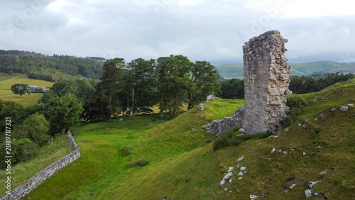 Tableau sur toile Aerial view showing the weathered stone remains of Harbottle Castle walls