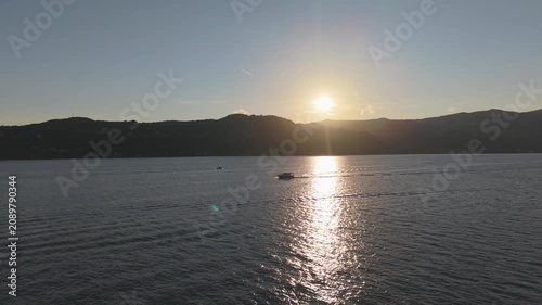 Aerial Sunset View of Mini Yacht Cruising on Lake Maggiore