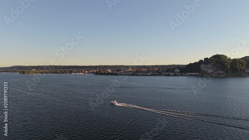 High Speed Motorboat Crossing Lake Maggiore at Sunset